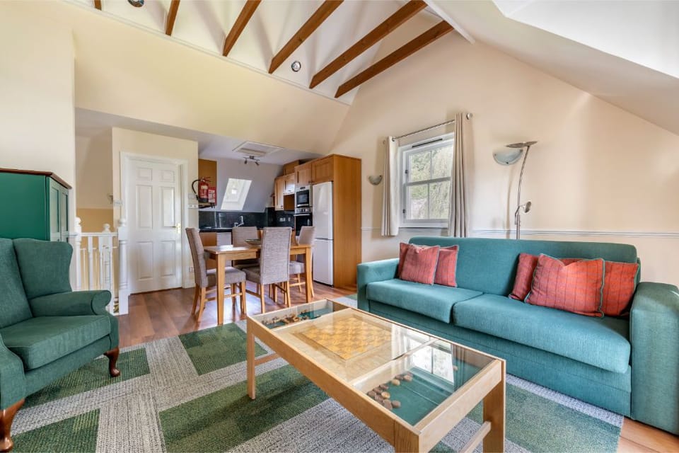 Welcoming living room with plush seating and rustic charm.