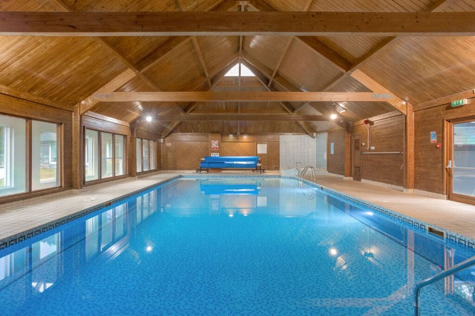 Indoor pool with a tranquil and inviting atmosphere.