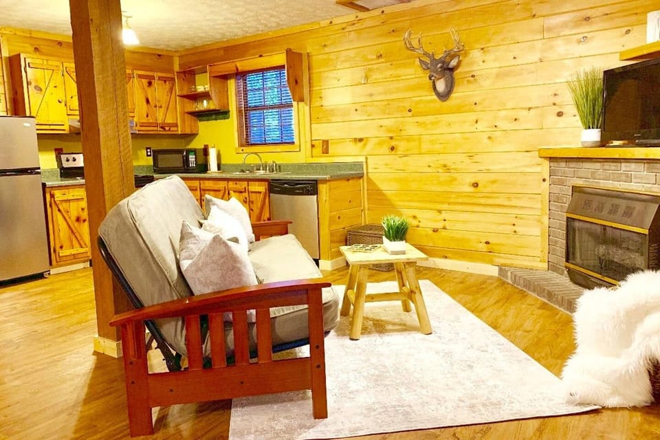 Open studio layout with queen bed + fold out couch + dinette