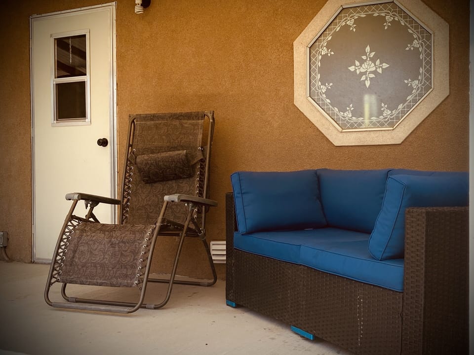 Relax in the quiet comfort of the back porch.