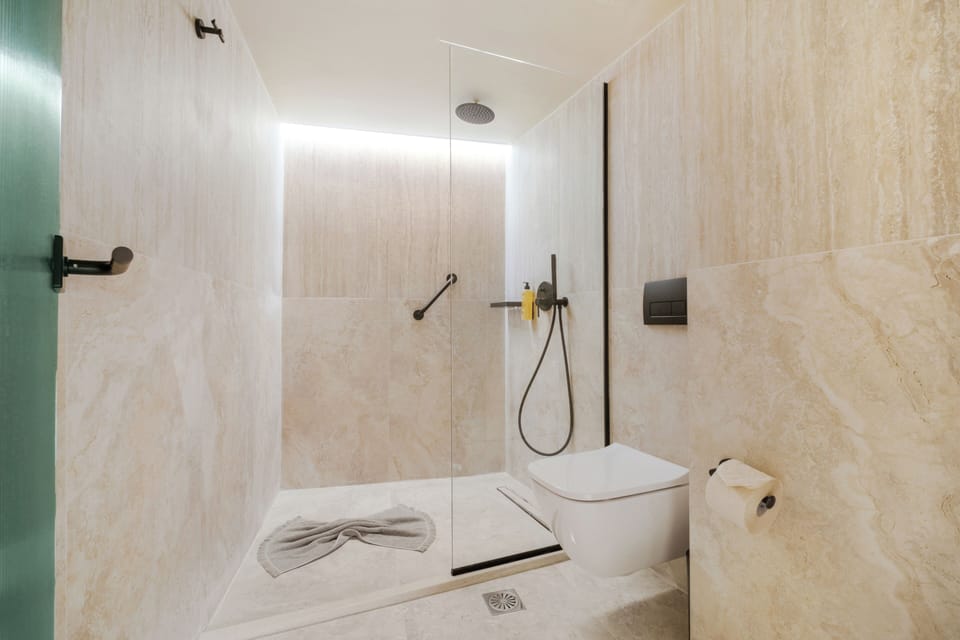 Shower, free toiletries, hair dryer, slippers