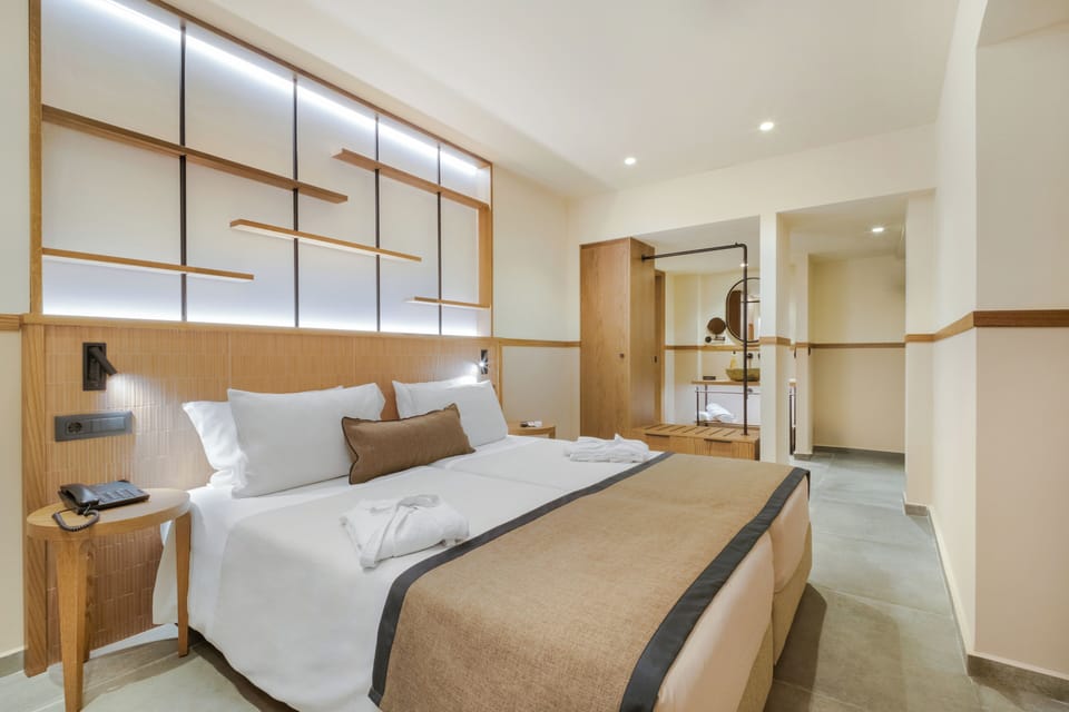 Junior Suite, Balcony | Down comforters, in-room safe, desk, laptop workspace