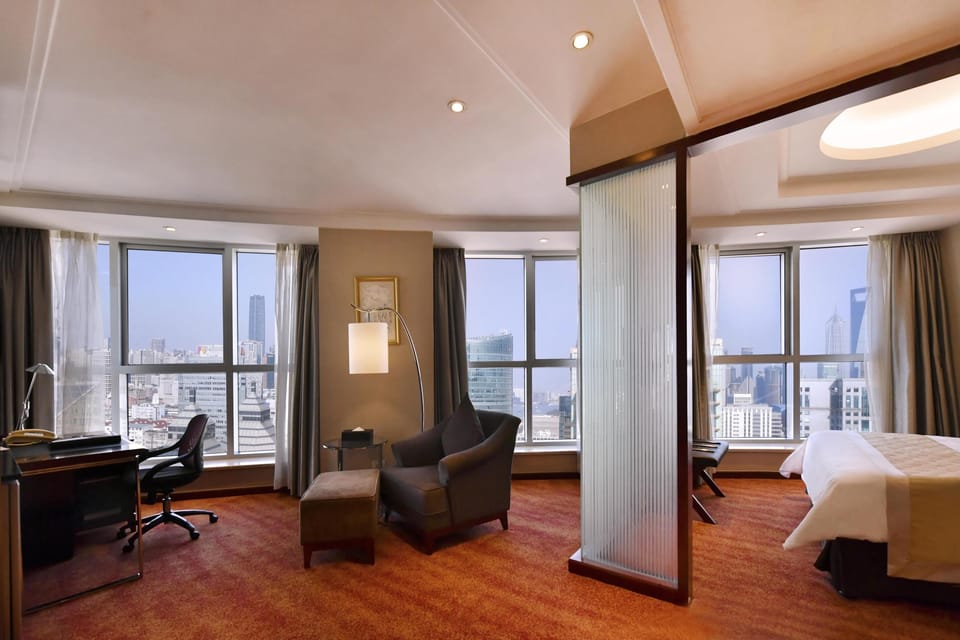 Premium bedding, down comforters, pillowtop beds, minibar