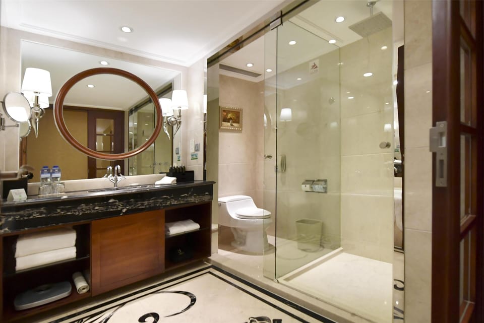 Deep soaking tub, designer toiletries, hair dryer, bathrobes