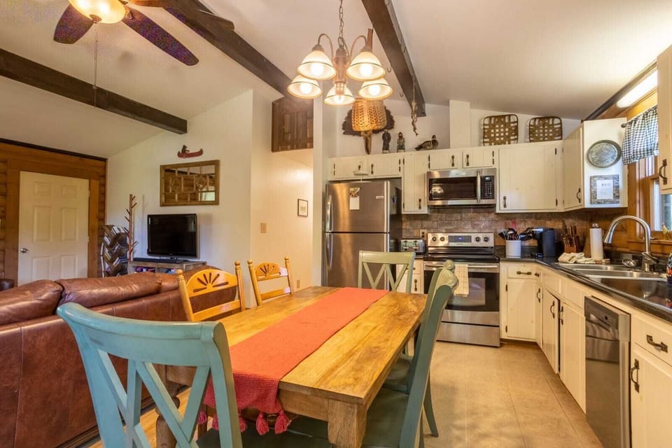 Kitchen with Granite Counter Tops and Stainless Steel Appliance