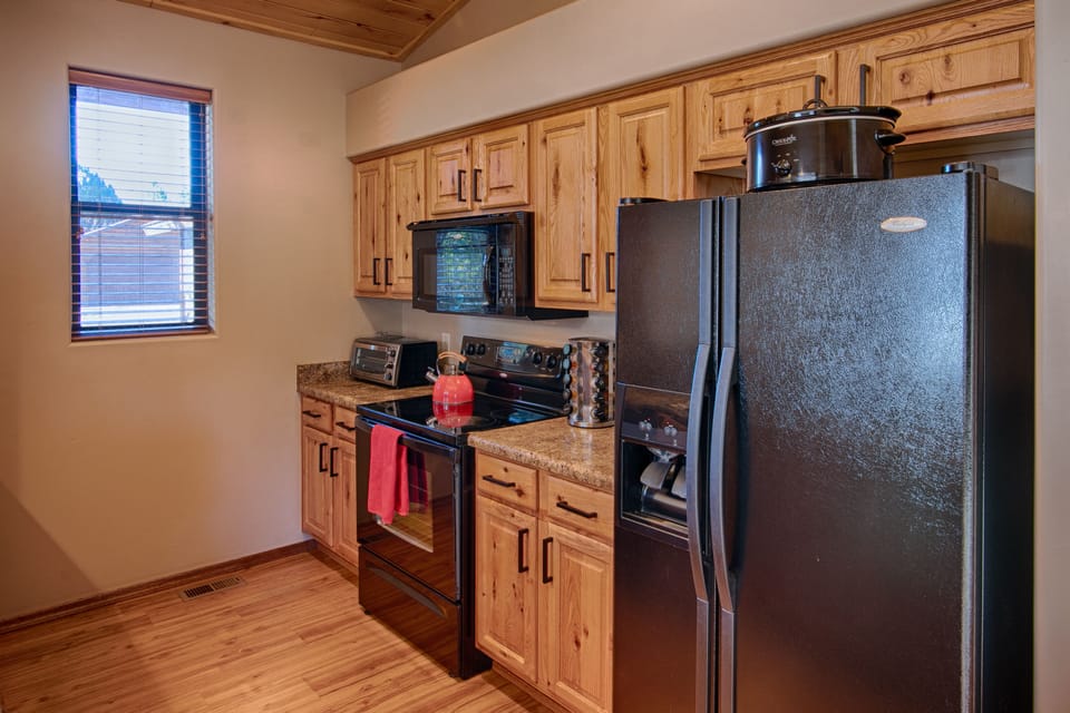 Kitchen equipped w/coffee maker, toaster oven, blender, crock pot