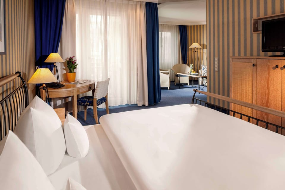 Hypo-allergenic bedding available, minibar, in-room safe