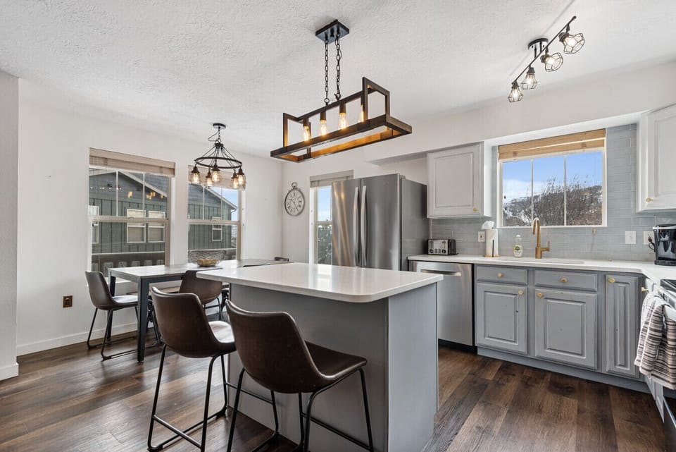Sleek kitchen with seating for two at the breakfast bar