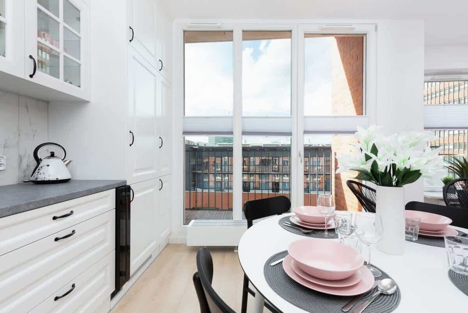 A closer look at the kitchen, emphasizing its functionality with ample storage space and a neat design.