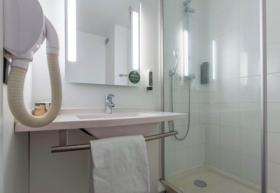 Shower, free toiletries, hair dryer, towels