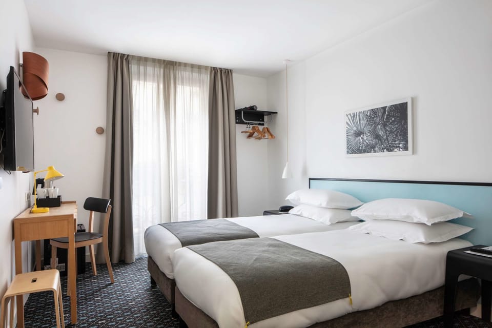 Twin Room - Complimentary soft minibar,courtesy tray, Chromecast and digital press | Minibar, in-room safe, desk, blackout drapes