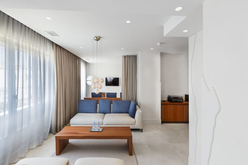 Suite, 1 King Bed, Sea View | Living area | TV