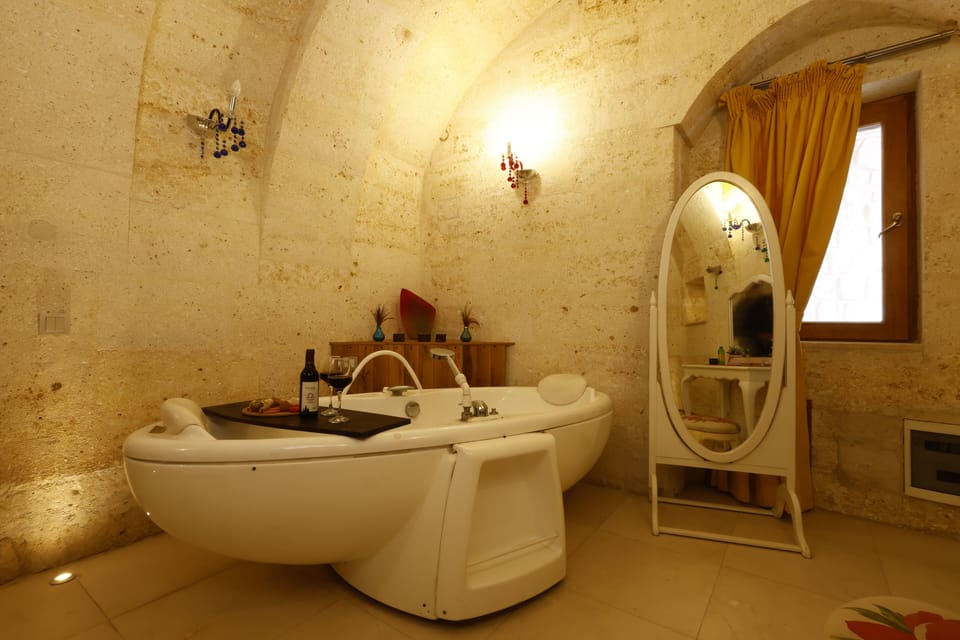 Romantic Suite | Bathroom | Designer toiletries, hair dryer, bathrobes, slippers