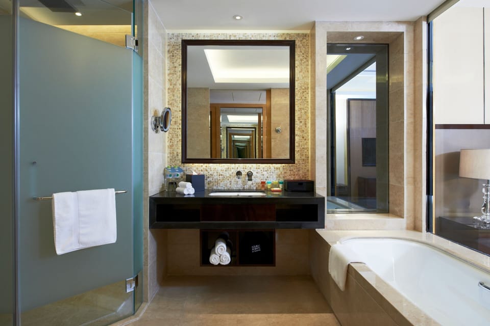 Separate tub and shower, rainfall showerhead, free toiletries