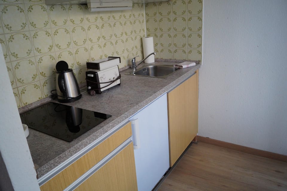 Apartment | Private kitchen | Fridge, stovetop, coffee/tea maker, cookware/dishes/utensils