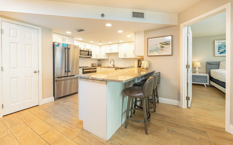 Sip your morning coffee at the counter, feeling the inviting vibe of your coastal retreat