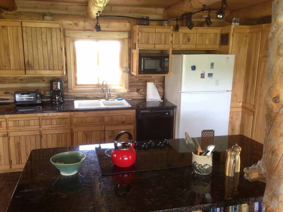 Kitchen with granite countertops and custom cabinets