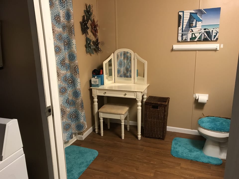 Full bath with tub/shower combo.