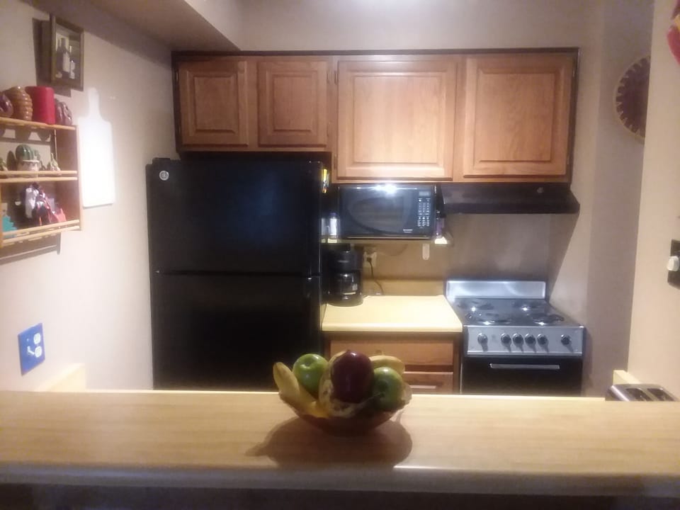 Kitchen showing range microwave and oven