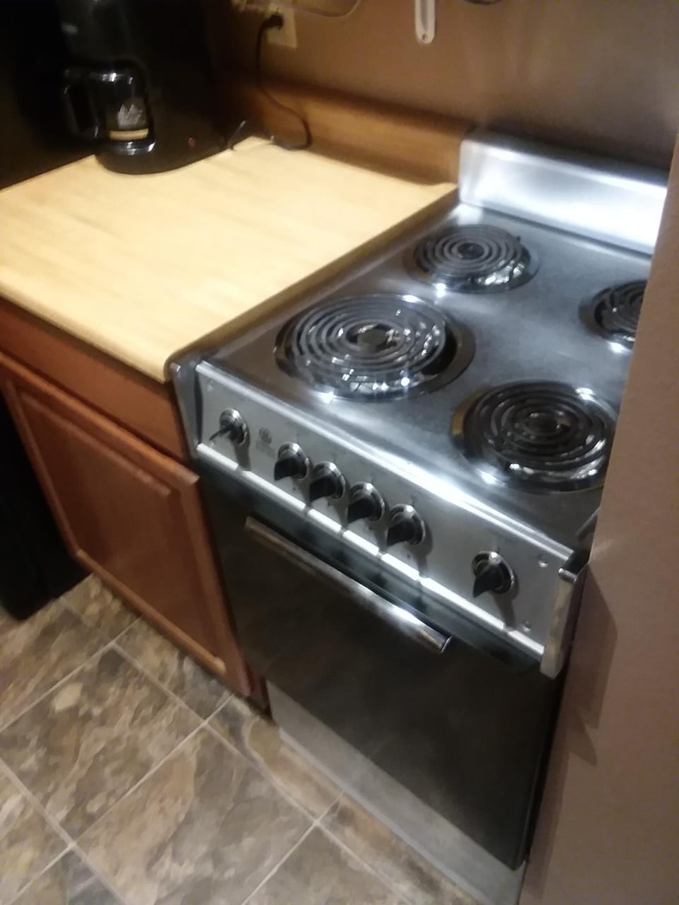 Kitchen showing range and coffee maker
