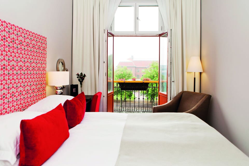 Standard Double Room | Minibar, in-room safe, desk, blackout drapes