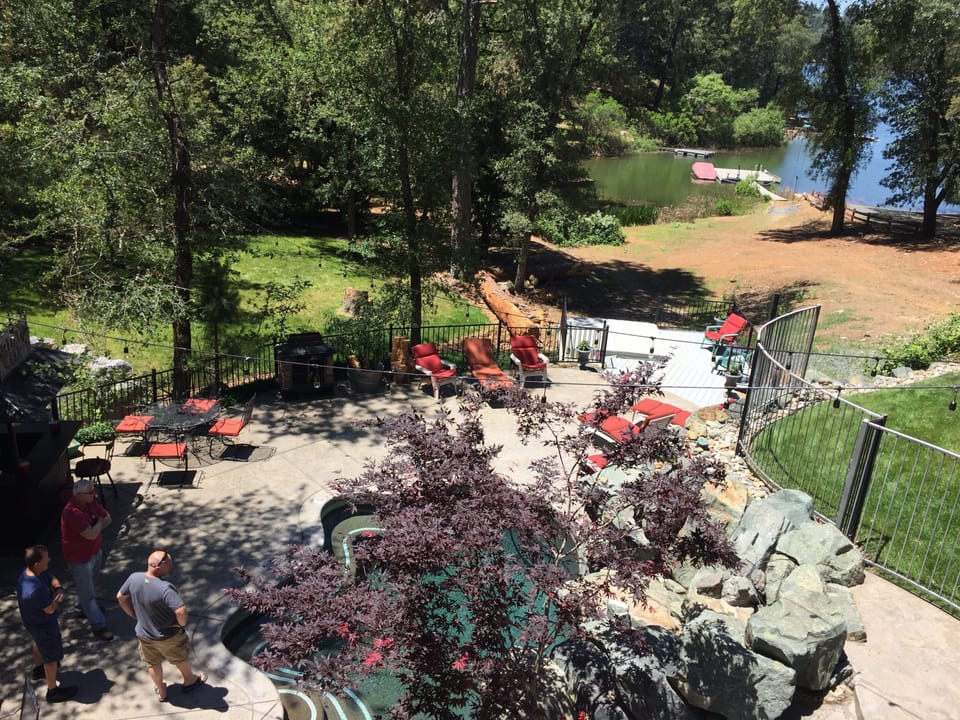 View of the pool and dock from the deck. 