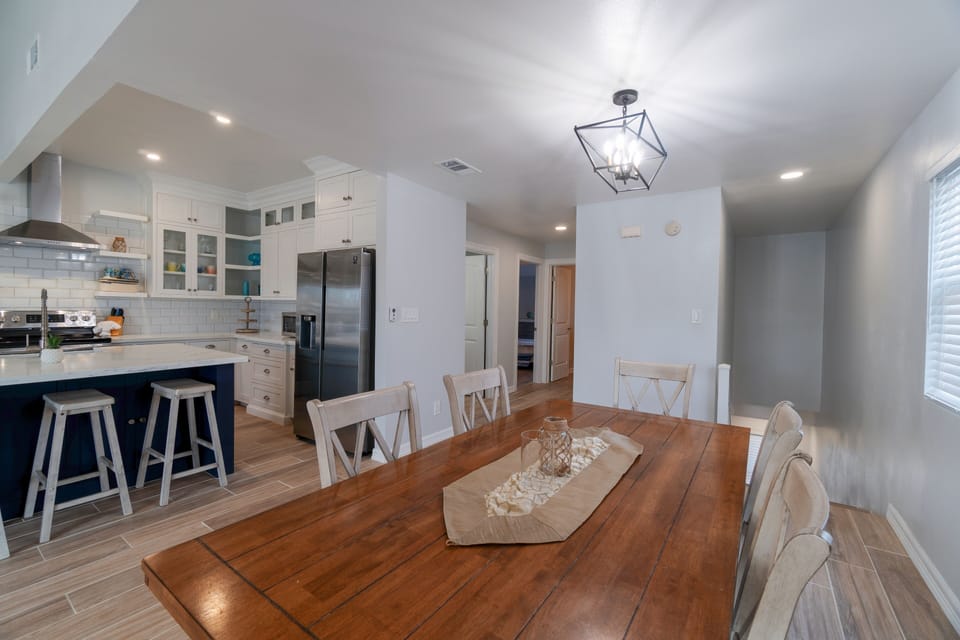 Gather around the dining table with seating for six, plus additional seating at the kitchen island.