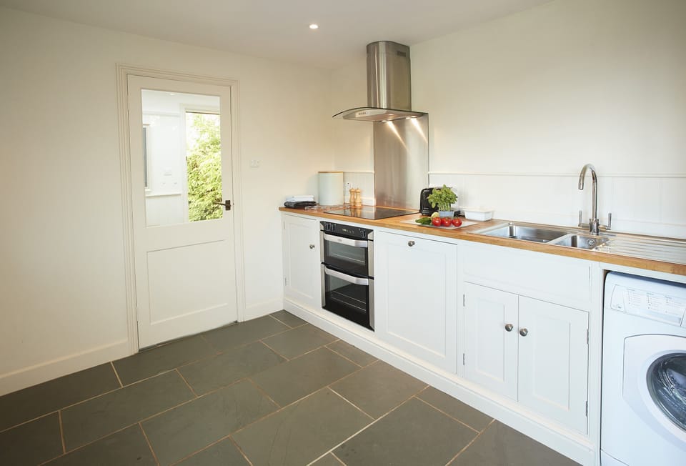 The kitchen with double electric oven and ceramic hob