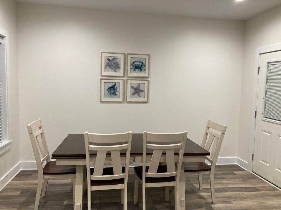 Dining table with 4 chairs and 1 bench.  Plenty of seating for the whole party.