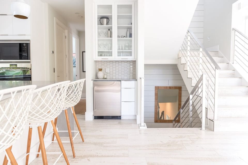 Kitchen view of bar area and stairs