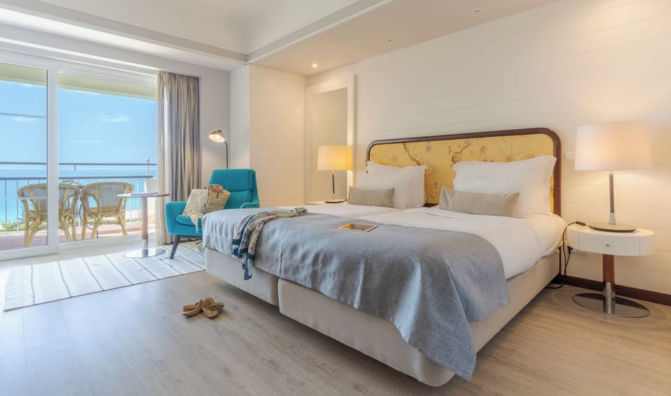 Double or Twin Room, Sea View | Minibar, in-room safe, desk, blackout drapes