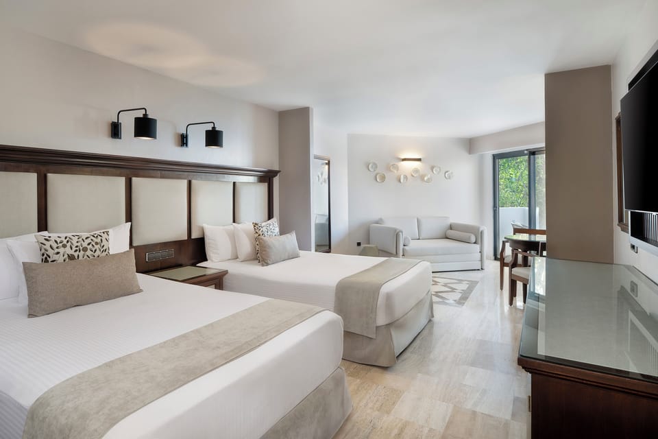 Down comforters, memory foam beds, free minibar, in-room safe