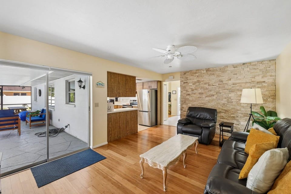 Open-concept living space with direct access to the pool and outdoor lounge