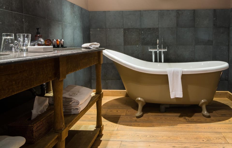 Separate tub and shower, rainfall showerhead, free toiletries