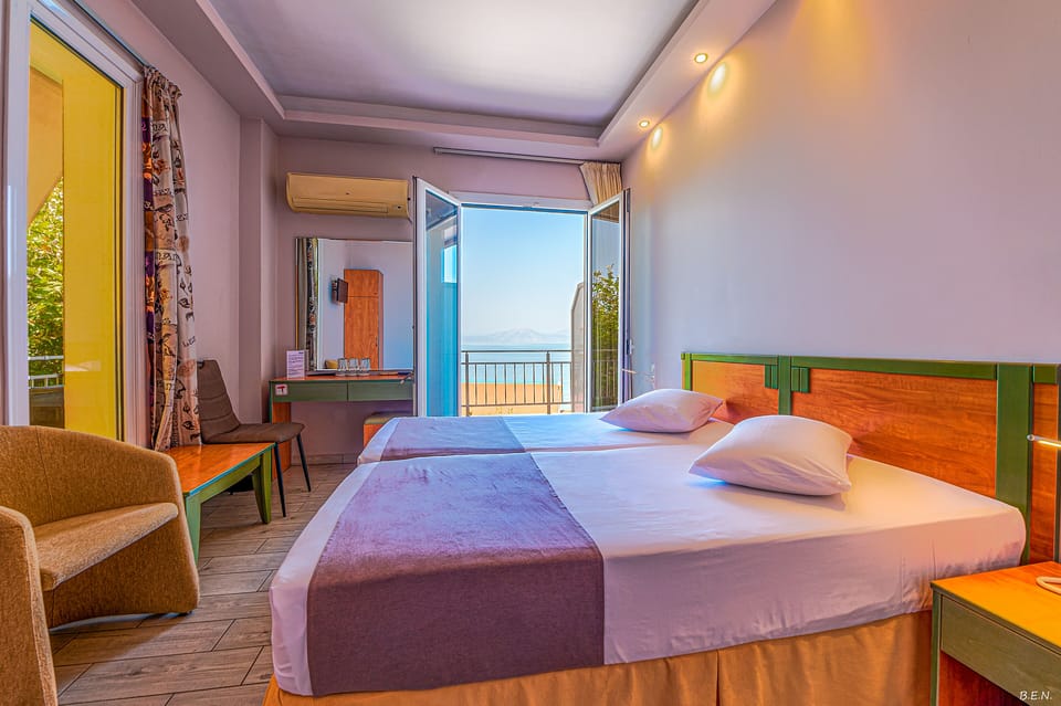 Triple Room, Sea View | Free cribs/infant beds, rollaway beds, free WiFi