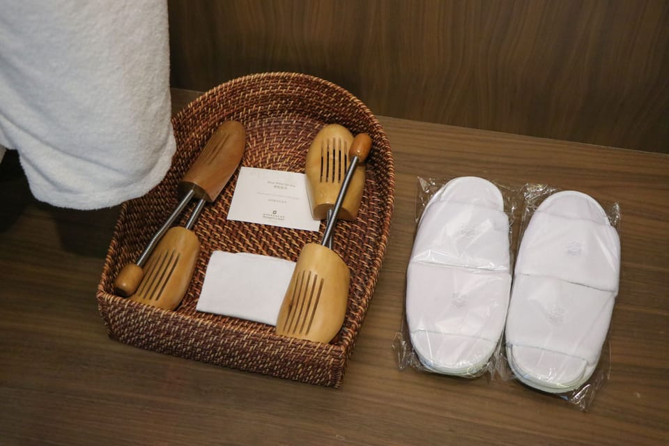 Separate tub and shower, designer toiletries, hair dryer, slippers