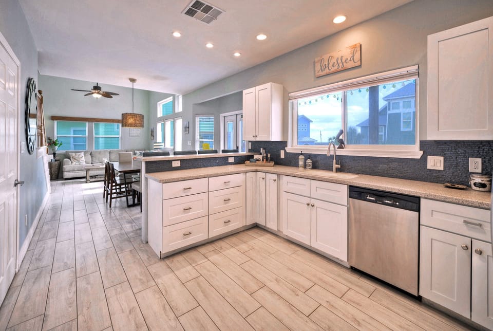 Bright spacious chef's kitchen with view towards Gulf of Mexico