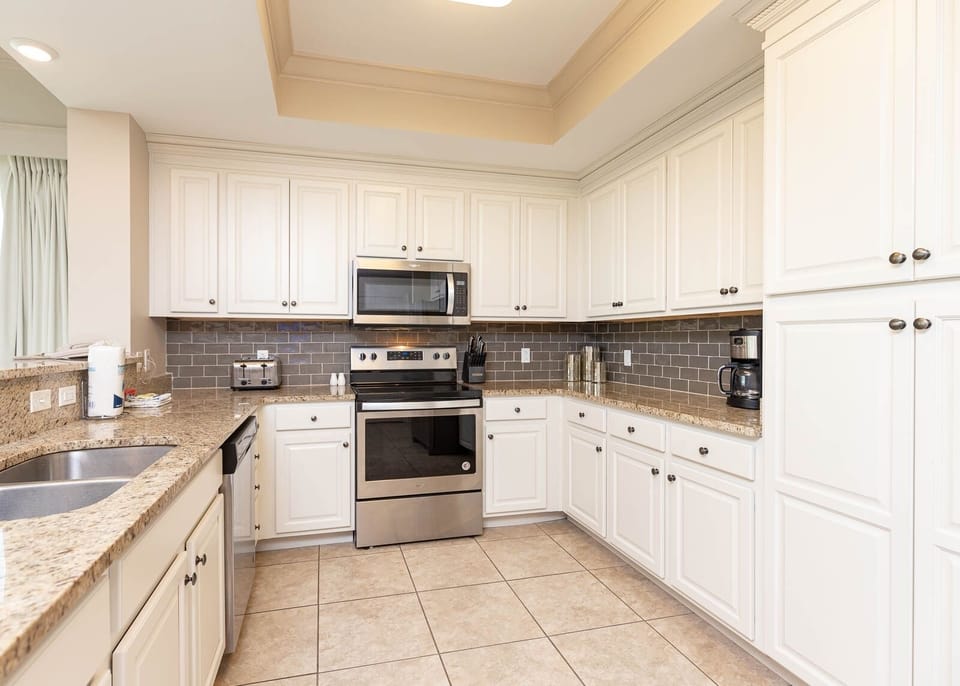 Create delicious meals in the kitchen, where ample counter space invites culinary creativity and conversation