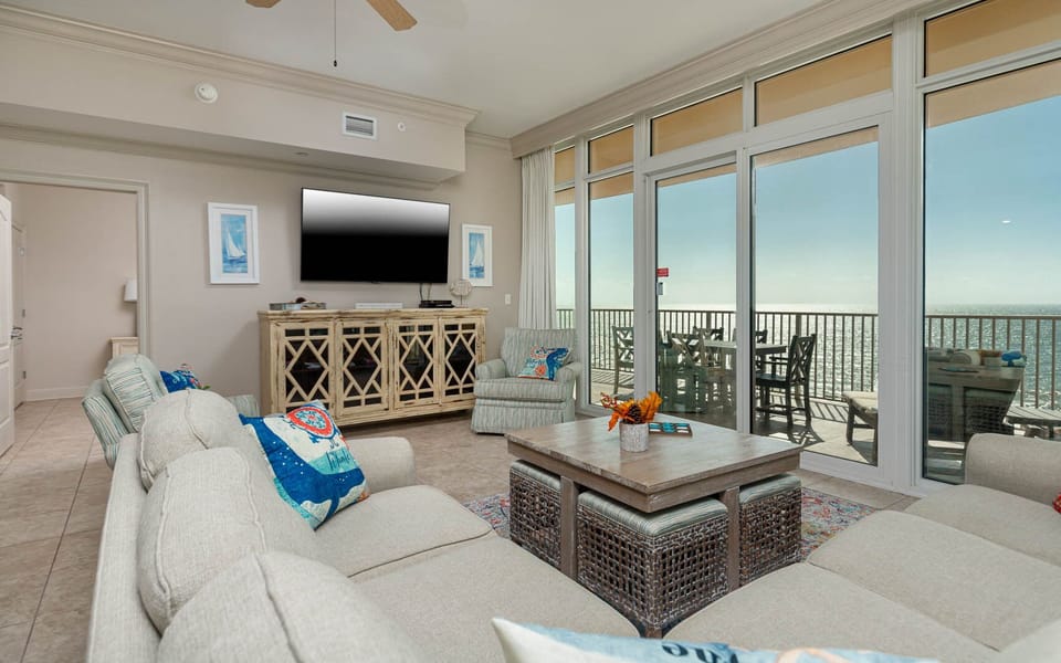 Unwind in the living area on the sofa with queen sleeper, streaming your favorite shows while embracing the beach view