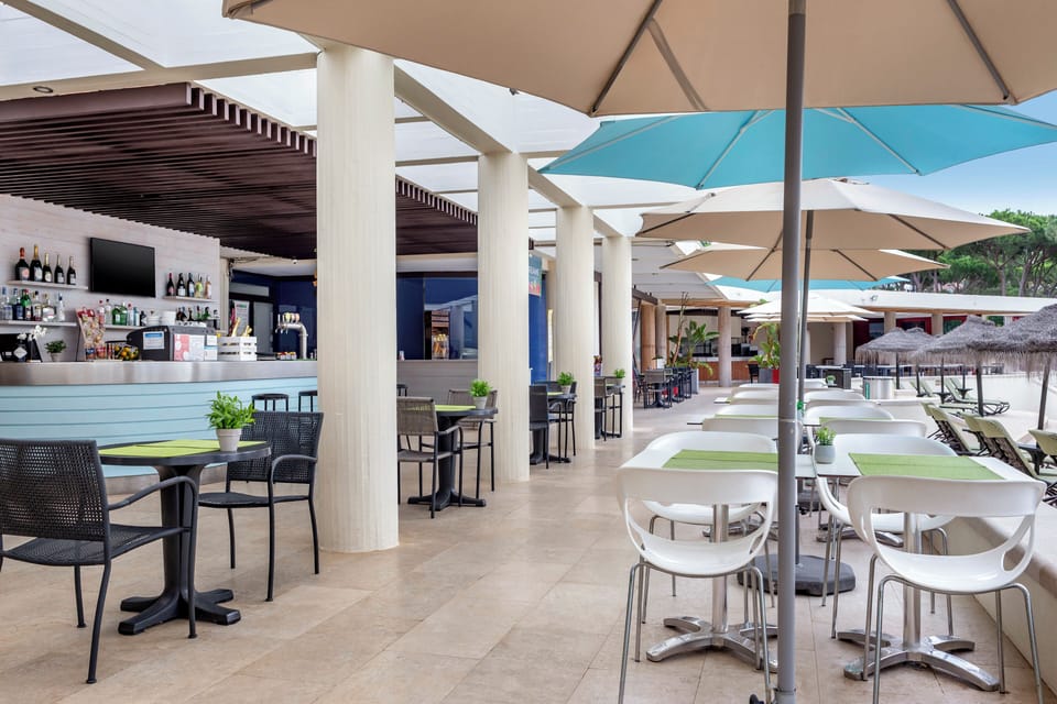 Dine at the breezy poolside café with easy access to refreshments all day.