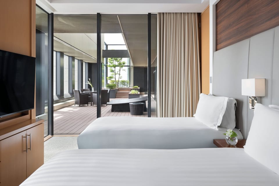 Premium bedding, down comforters, pillowtop beds, minibar