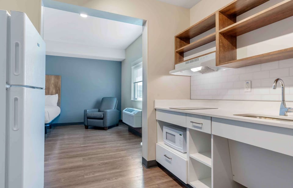 Desk, iron/ironing board, bed sheets