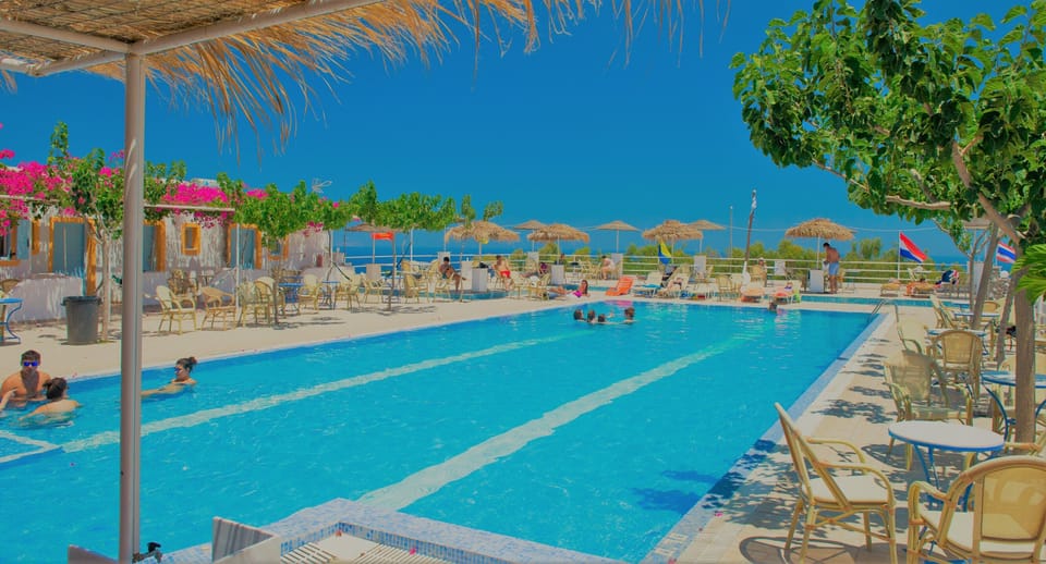 Outdoor pool, open 9:00 AM to 8:00 PM, pool umbrellas, sun loungers