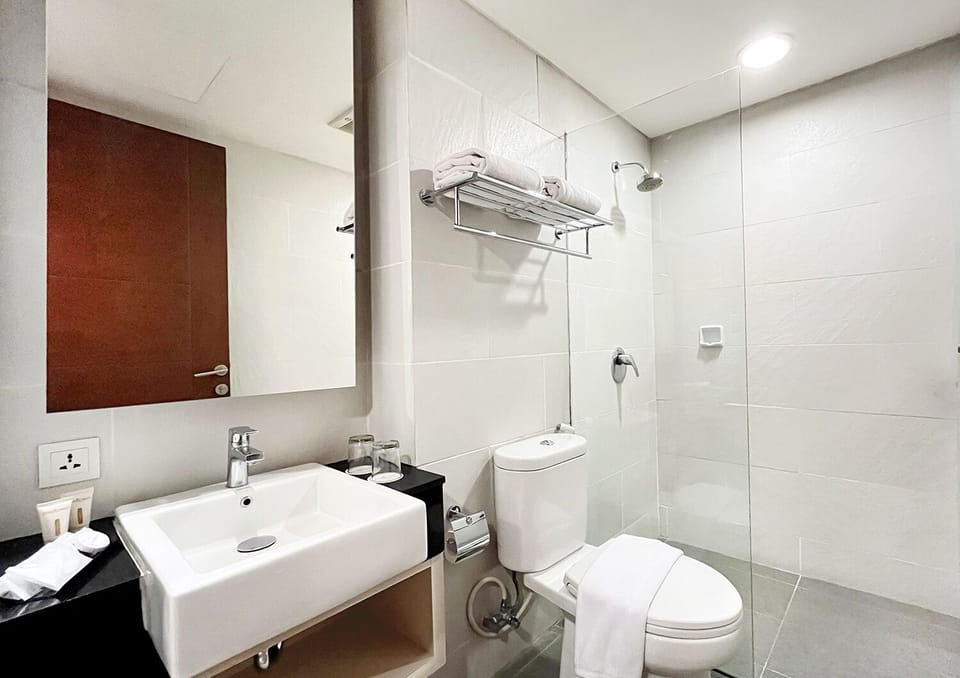 Shower, free toiletries, slippers, towels