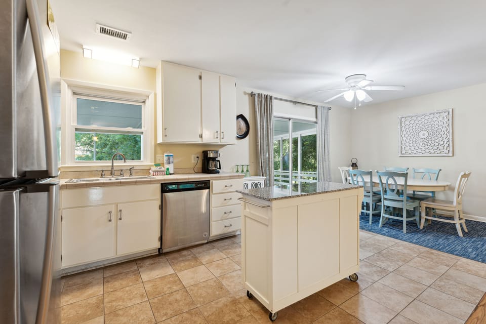Main floor, fully equipped kitchen, with island for room to prep meals.