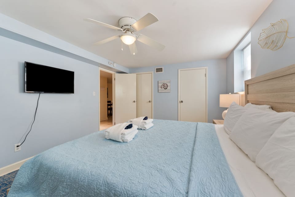 Downstairs bedroom featuring a King bed and smart TV.