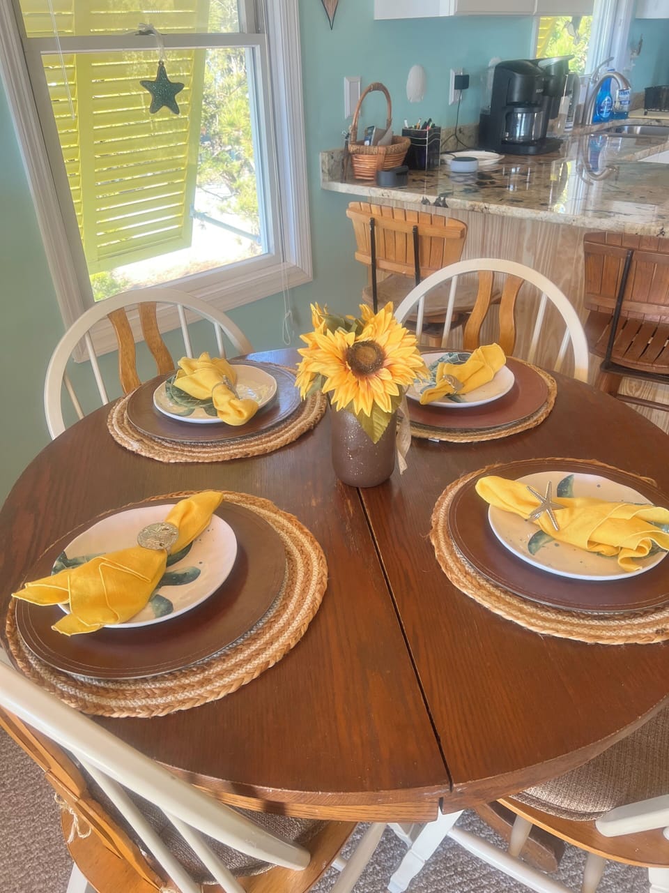Dining table for four - has leaves to make room for six.
