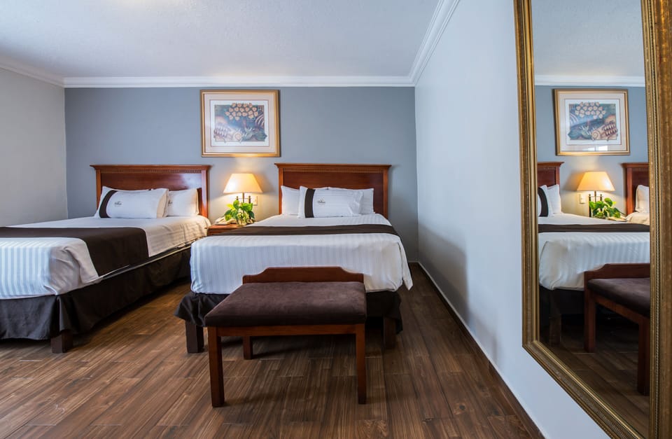 Standard Room, 2 Double Beds | In-room safe, desk, iron/ironing board, free cribs/infant beds