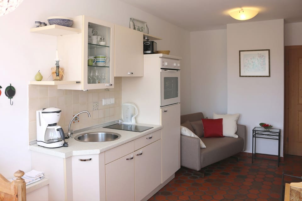 Apartment, Garden View | Private kitchen | Fridge, stovetop, coffee/tea maker, electric kettle