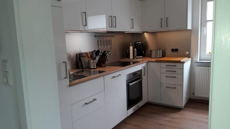 Apartment | Private kitchen | Fridge, stovetop, electric kettle, cookware/dishes/utensils